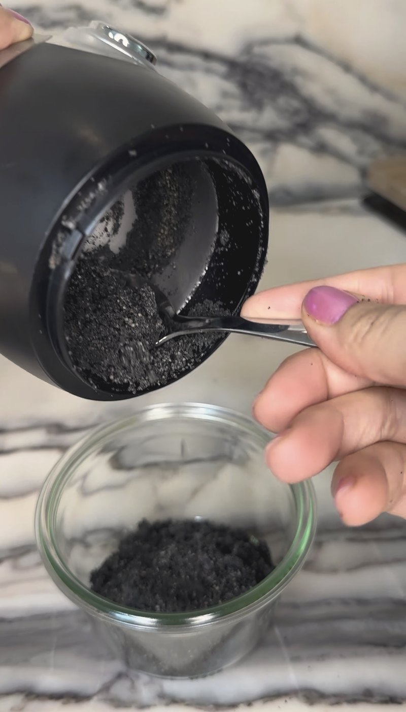 ground black seed spooned into a jar