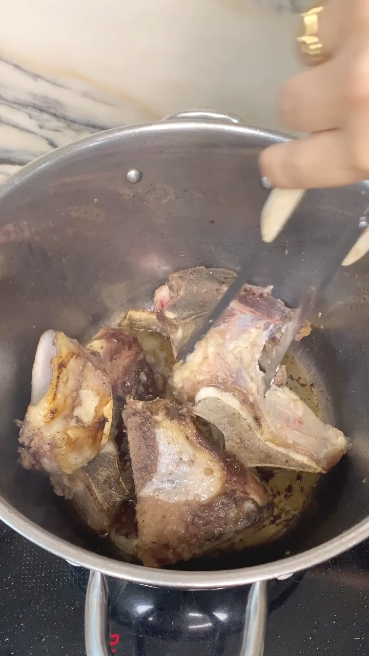 beef bones browning in the pot before any water goes in